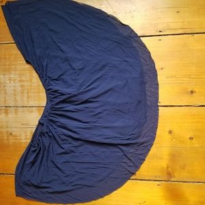 Tank top with lose material around it, like new.